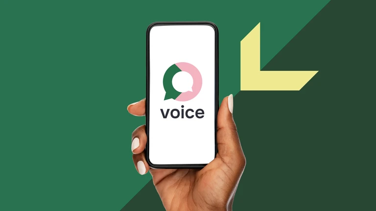 Woman's hand holding a mobile phone showing the Voice logo