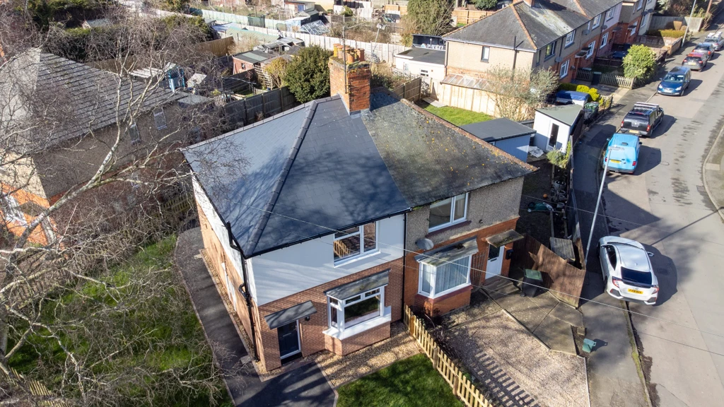 An overhead view of two neighbouring homes in Rushden - the one on the left having been improved and upgraded