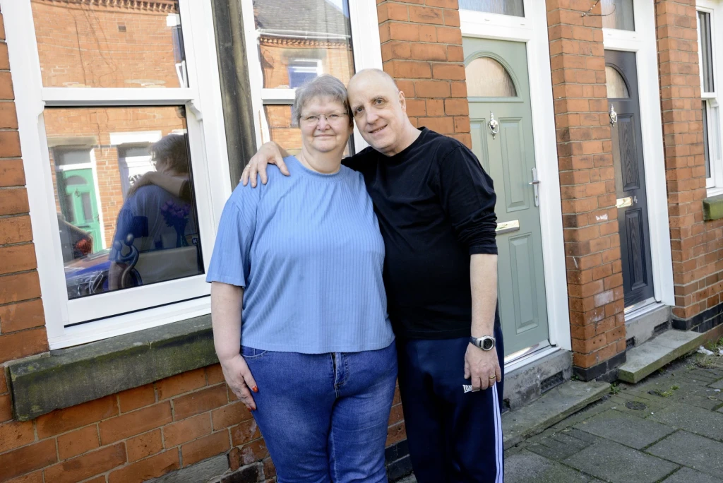 Dorothy and Gary in front of their home in Sneinton