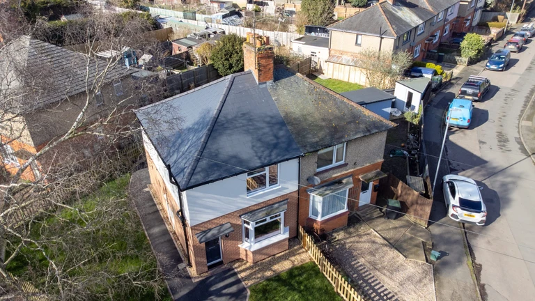 An overhead view of two neighbouring homes in Rushden - the one on the left having been improved and upgraded