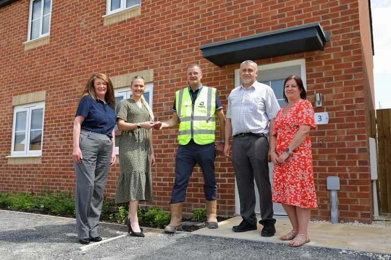 Lovell and Amplius colleagues outside a new home at Tennyson Fields