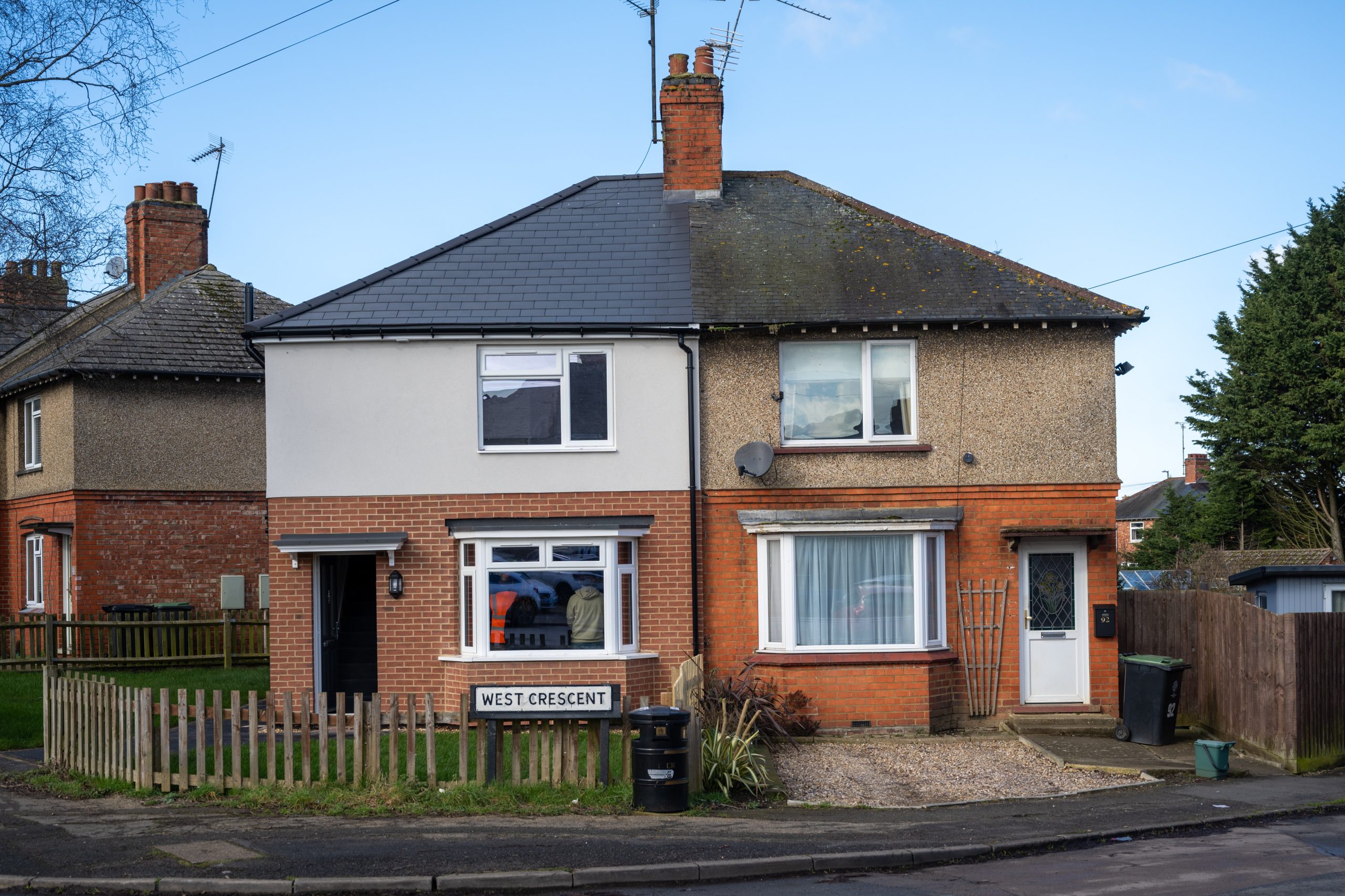 View of two neighbouring houses in Rushden - the one on left has been upgraded and improved