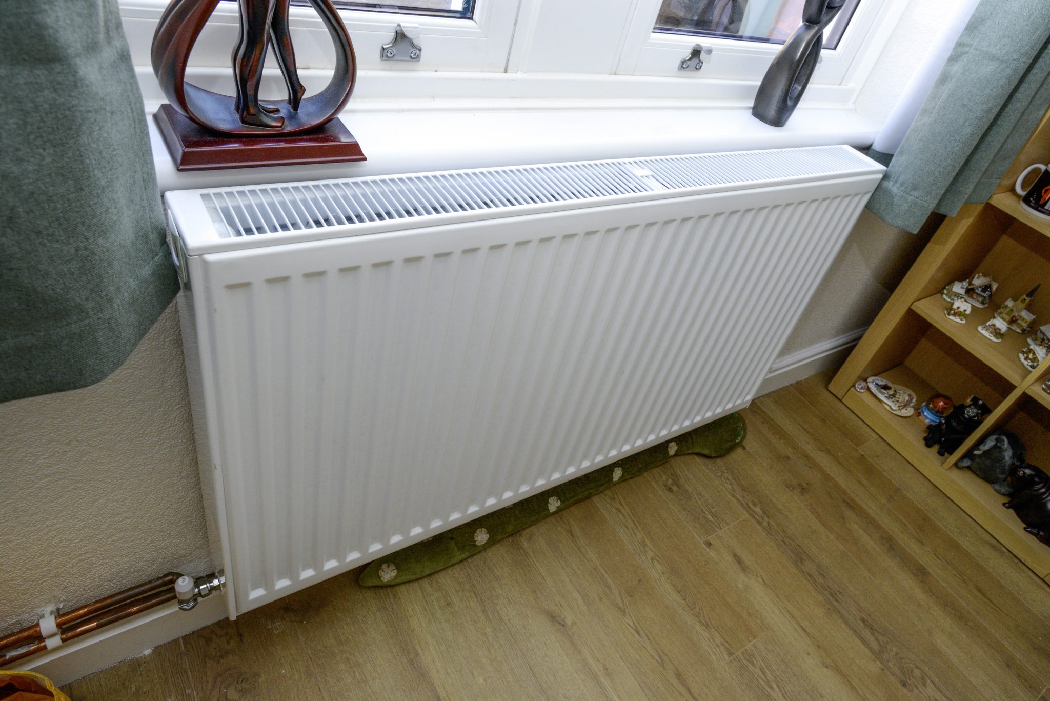 A new radiator at Dorothy and Gary's, situated below a window